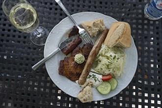 Steaks and bratwurst with coleslaw and quark served in a garden pub, Bavaria, Germany, Europe