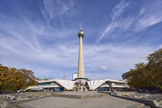 Berlin television tower with stairs against blue sky with cirrostratus clouds, Panoramastraße,