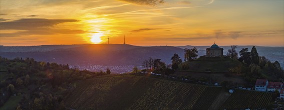 Sunset at the burial chapel on the Württenberg, the television tower on the horizon. Aerial view,