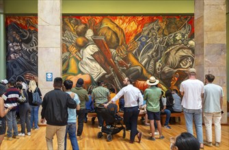 People viewing 'Katharsis' 1934 mural by Jose Clemente Orozco, Palacio de Bellas Artes, Palace of