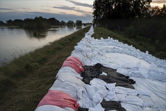 Reinforcement of river embankments with sandbags, flood risk in Poland