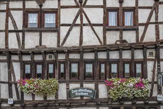 An old half-timbered town in autumn. A church was built into a rock here. Unique German