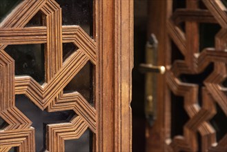 Rich decorated door in an Arab palace in Marrakech, Morocco, Africa