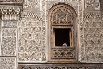 Rich decorated facade in the courtyard of the Medersa Attarine in Fes, Morocco, Africa