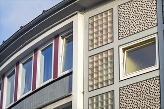 Rows of windows on an older residential building