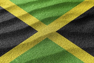 Jamaica sand flag, national flag sand background