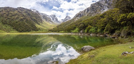 Tranquil mountain lake Mackenzie at the famous Routeburn Track, Fiordland National Park, South