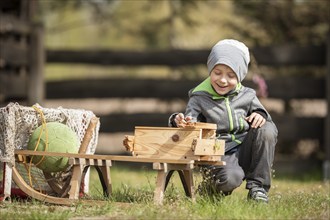 Smiling 6 years old boy playing aoutdoor