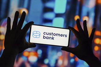 In this photo illustration, the Customers Bank logo seen displayed on a smartphone