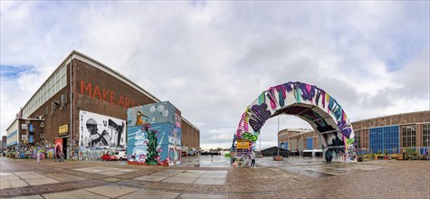 A picture of the STRAAT Museum's building and nearby art installations