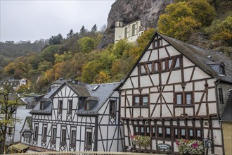 An old half-timbered town in autumn. A church was built into a rock here. Unique German