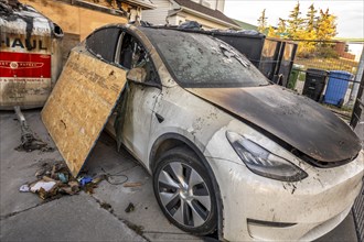 Calgary, Alberta, Canada. Oct 10, 2023. An electric Tesla car with fire damage in from a front