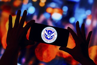 In this photo illustration, the United States Department of Homeland Security (DHS) logo is