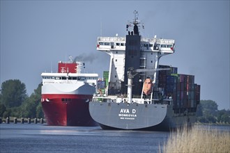 Container ship AVA D and car carrier KESS meet in the Kiel Canal, Kiel Canal, NOK,