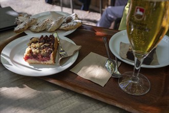 Plum cake and pastries on a table in a garden café, Bavaria, Germany, Europe