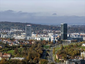 Pragsattel with skyline skyscraper and Porsche Design Tower. City view of Stuttgart from the air.