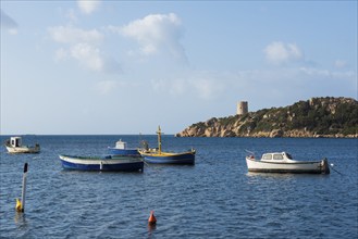 Fishing boats and Genoese tower, Porto di Teulada, south coast, Sardinia, Italy, Europe