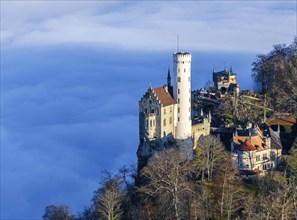 Sunshine in the mountains, fog in the Echaz valley. Lichtenstein Castle in the Swabian Alb. The