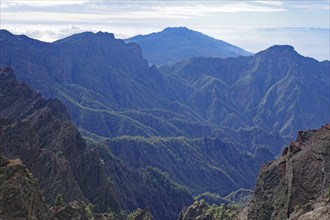 Rugged mountains stretch out under a cloudy sky, Caldera de Taburiente, Roques de los Muchachos, La