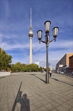 Lantern and Berlin TV tower under blue sky with cirrostratus clouds, Berlin, capital city,