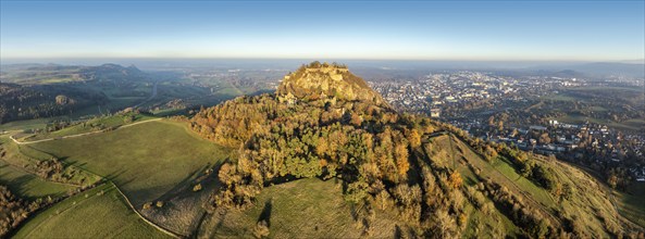 Aerial view, panorama of the volcanic cone Hohentwiel with the castle ruins illuminated by the