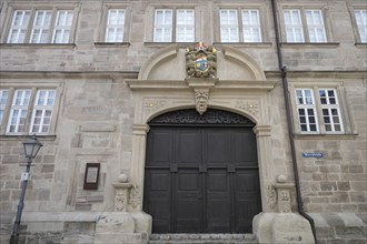 Former prince-bishop's rent office with coat of arms cartouche above the portal, from 1693, today