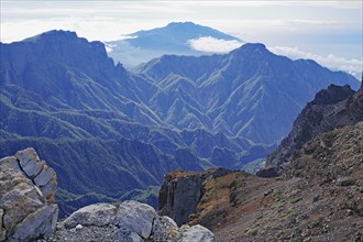 Expansive mountain landscape with imposing cliffs and clouds, view of the Caldera de Taburiente,