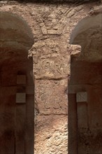 Stone-carved column at the entrance to the monolithic Bete Maryam rock-hewn church, UNESCO World