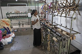 Sri Lankan woman in a weaving mill, Selyn Textiles, Kurunegala, North West Province, Sri Lanka,