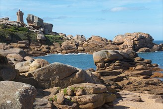 Rocky coast with lighthouse and blue sky in the background, Phare de Men Ruz, Ploumanac'h,