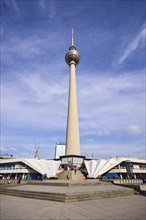 Berlin television tower with stairs against blue sky with cirrostratus clouds, Panoramastraße,