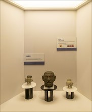 Carved stone head and tripod jars, archaeological site and museum of Templo Mayor, Mexico City,