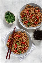 Udon noodles, with shimeji mushrooms, vegetables, in sauce, with sesame seeds, green onions, Asian