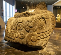 Monumental Xiuhcoatl stone sculpture of fa ire serpent, archaeological site and museum of Templo