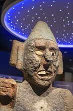 Stone carved face of Centzonhuitzuahuah, deity of pulque, archaeological site and museum of Templo