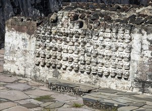 Wall of stone skulls called Tzompantli, archaeological site and museum of Templo Mayor, Mexico