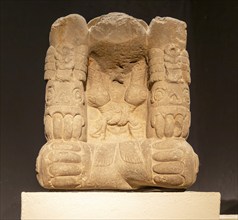 Carved stonework block depicting Mictlantecuhtli, Aztec god of the dead, archaeological site and