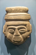 Carved stone Atzec face, archaeological site and museum of Templo Mayor, Mexico City, Mexico,