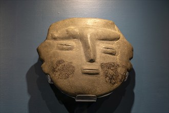 Carved stone Aztec face, archaeological site and museum of Templo Mayor, Mexico City, Mexico,