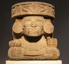 Carved stonework block depicting a masked God, archaeological site and museum of Templo Mayor,