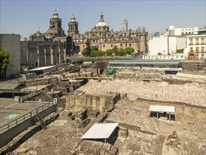 Templo Mayor archaeological Aztec city of Tenochtitlan, view to the cathedral church, Mexico City,