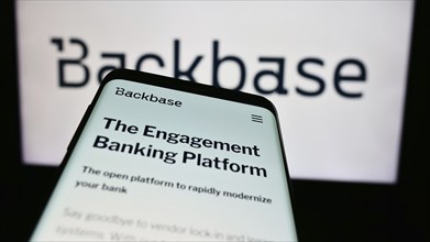 Stuttgart, Germany, 07-11-2024: Mobile phone with website of Dutch fintech company Backbase B.V. in