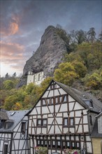 An old half-timbered town in autumn. A church was built into a rock here. Unique German