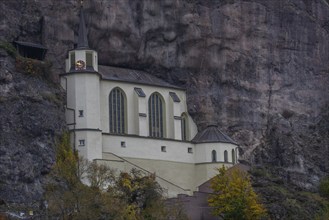 An old half-timbered town in autumn. A church was built into a rock here. Unique German