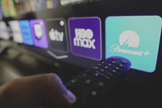 In this photo illustration the Paramount Plus, HBO Max and Apple TV logo is displayed on a TV