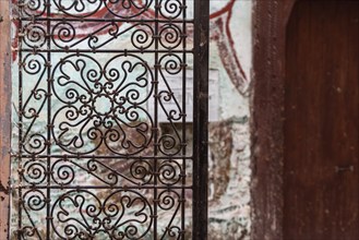 Old ornamental door grille with a floral pattern in the medina of Fes, Morocco, Africa