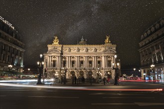 Famous Paris Opera at Night, lights of the traffic leading around, France, Europe