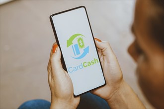 In this photo illustration, the CardCash logo is displayed on a smartphone screen