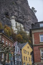 An old half-timbered town in autumn. A church was built into a rock here. Unique German