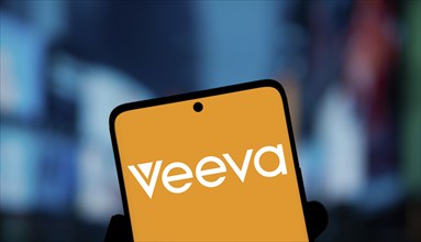 Veeva Systems logo is displayed on smartphone. Veeva Systems Inc is an American cloud computing